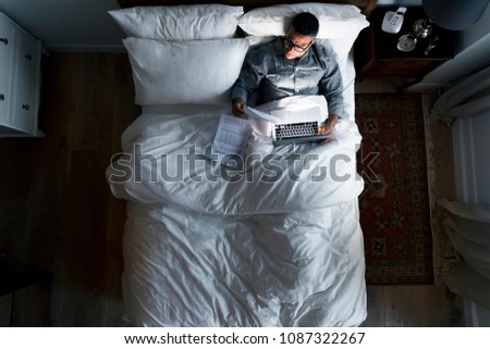 Business man on bed working at night