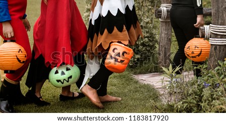 Young kids trick or treating during Halloween