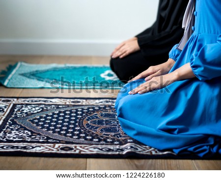 Muslim prayers in Tashahhud posture