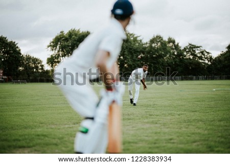 Cricket bowler throwing the ball