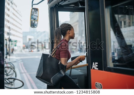 Woman getting on the bus