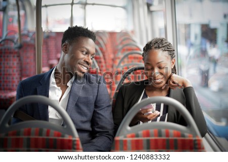Business partners riding the bus to work