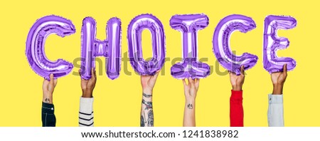 Hands holding choice word in balloon letters