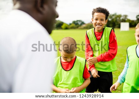 Football coach training his students