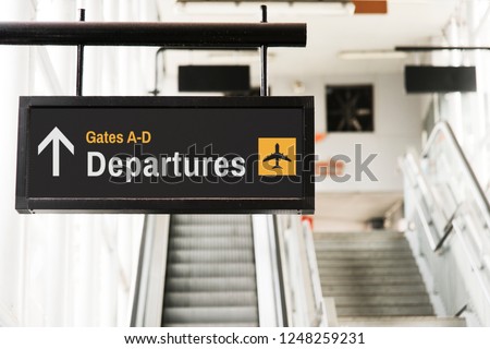 Hanging sign mockup in front of an escalator