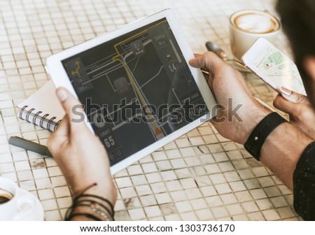Man using navigate application searching place