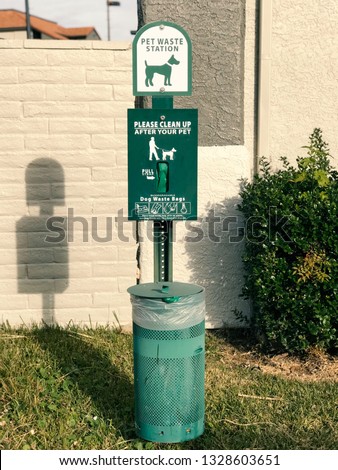 Green outdoor pet waste station