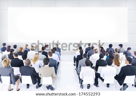 Large group of business people in presentation.