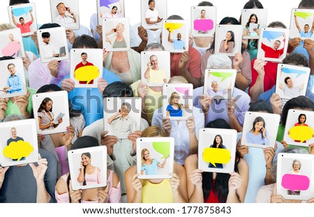 Multi-Ethnic Group of People Holding Tablets in Front of the Faces
