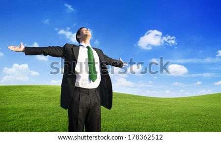 Businessman Relaxing on a Hill