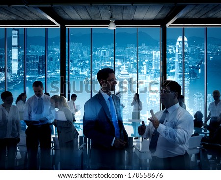Business People Working in a Conference Room with City Skyline