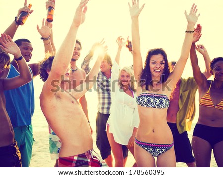 Young People Dancing at Summer Beach Party