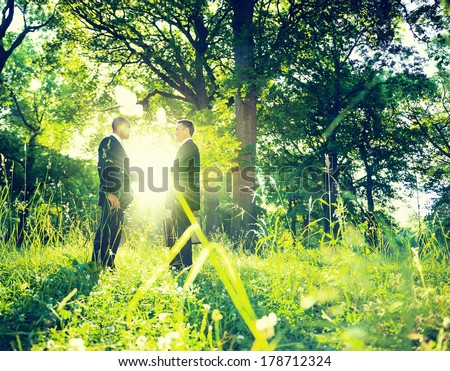 Environmentalist Businessmen Shaking Hands in Green Park