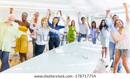 Casual Diverse Business People Celebrating at Conference Table
