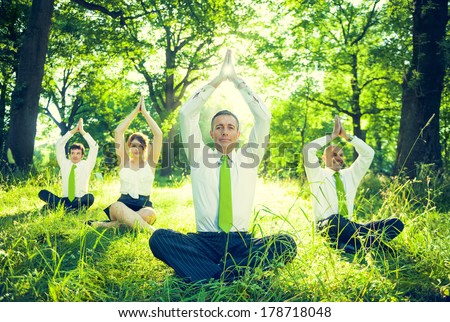 Business People Doing Yoga in Green Forest