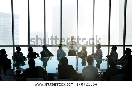 Leader Talking to Business Team at Meeting Table