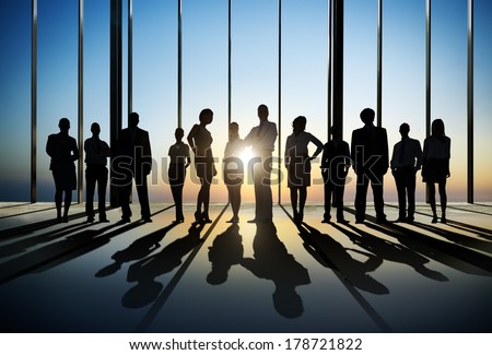 Silhouette of Business People Posing by Window