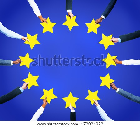 Multi-Ethnic Business Hands Holding Stars To Form The European Union Flag