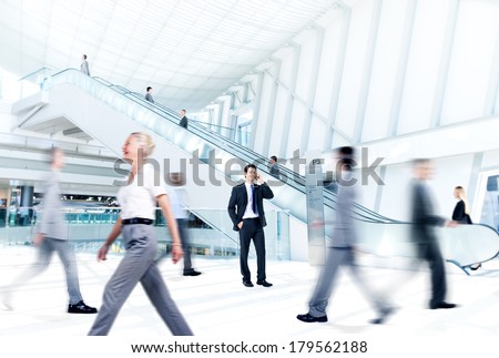 Business People at Rush Hour in Office Building