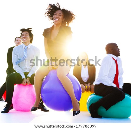 Business People Jumping on Bouncy Balls