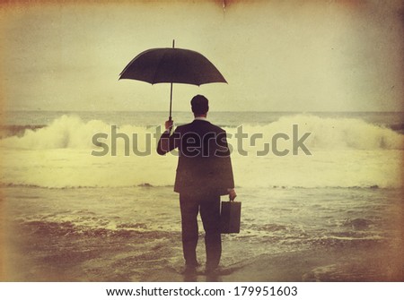 Businessman With Umbrella at Stormy Ocean Vintage Style
