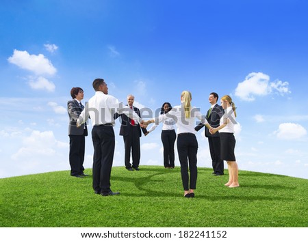 Business People Holding Hands On a Hill
