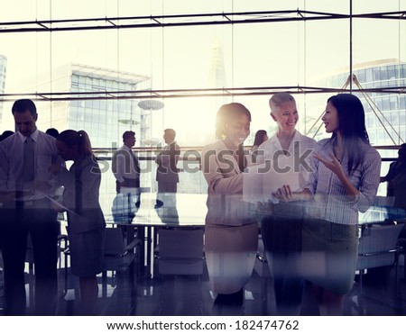 Multi-Ethnic Group Of Business People Working In A Board Room
