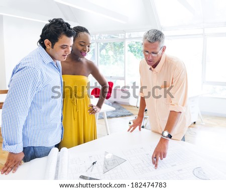 Architect Presenting Blueprint Of Home