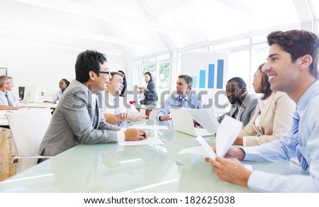 Group of Multi Ethnic Cheerful Corporate People Having a Business Meeting