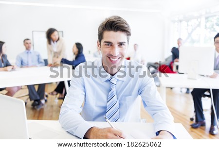 Cheerful Corporate Businessman Working In Office