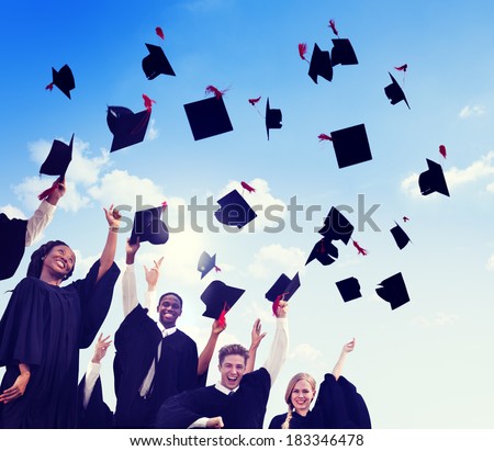 Group Of Graduating Student Throwing Caps In The Air