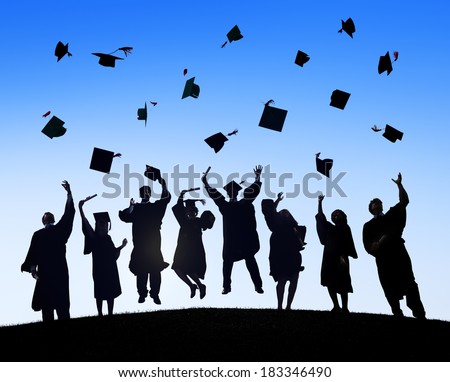 Group Of Students Celebrating Graduation and Throwing Caps