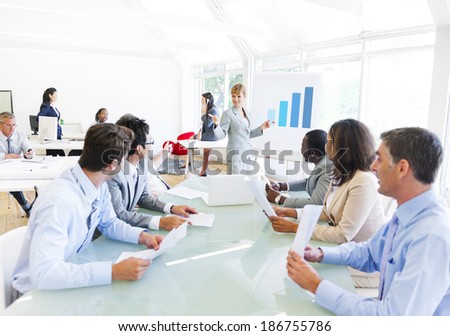 Business Presentation of a Corporate Woman to her Colleagues