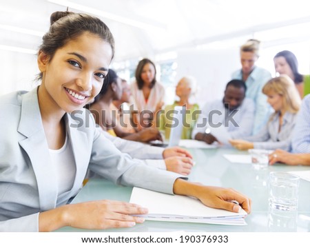Black Business woman in conference with associates