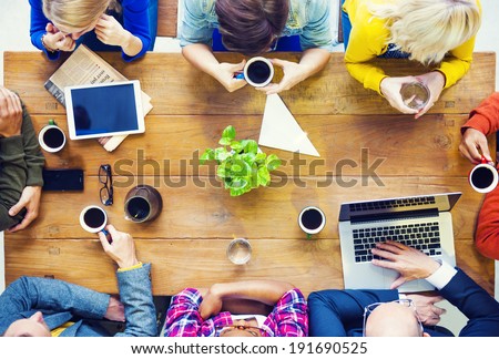 Multiethnic People with Startup Business Talking in a Cafe