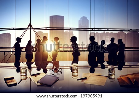 Silhouettes of Business People Brainstorming Inside the Office