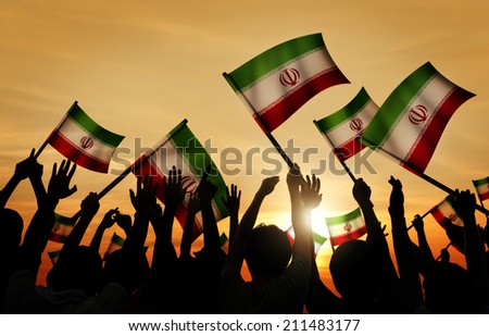 Silhouettes of People Holding Flag of Iran