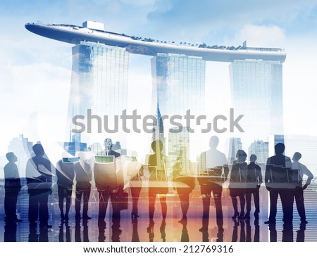 Silhouettes of Business People and Marina Bay
