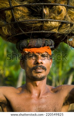 Indigenous manual labor worker carrying on the head.