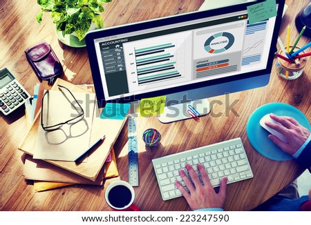 Man Working in the Office Regarding Accounting