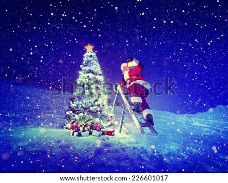 Santa with lamp on a step-ladder by the christmas tree.