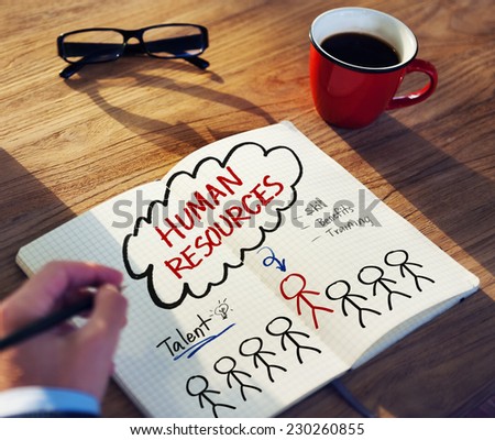 Man with Note Pad and Human Resources Concepts