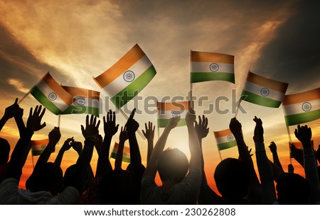 Group of People Waving Indian Flags in Back Lit