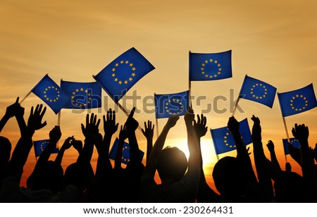 Group of People Waving European Union Flags in Back Lit