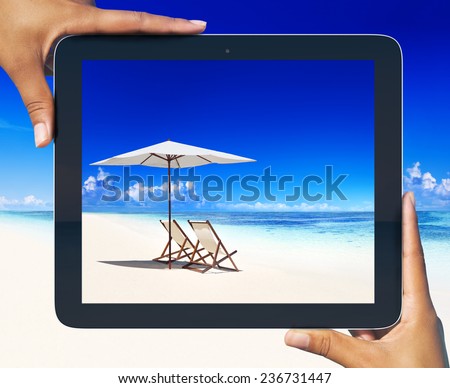Digital tablet frame at tropical beach.