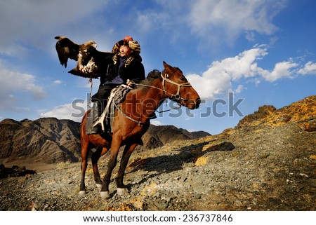 Kazakh men traditionally hunt foxes and wolves using trained golden eagles. Olgei,Western Mongolia.
