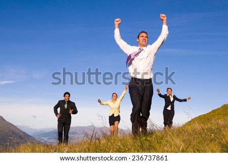 Business people running on the mountains.