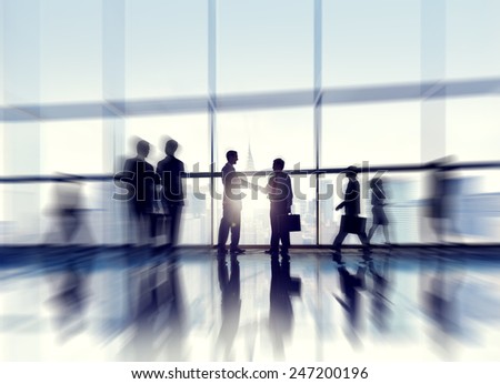 Group of business people standing in a office building.