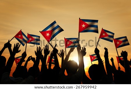 Silhouettes of People Holding Flag of Cuba