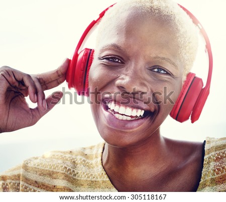 African Woman Headphones Listening Music Concept